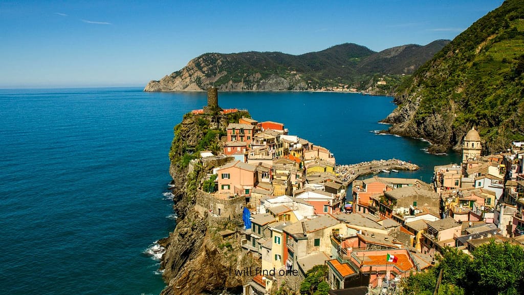 Cinque Terre Italy coastline with colorful seaside village on cliffs overlooking blue water