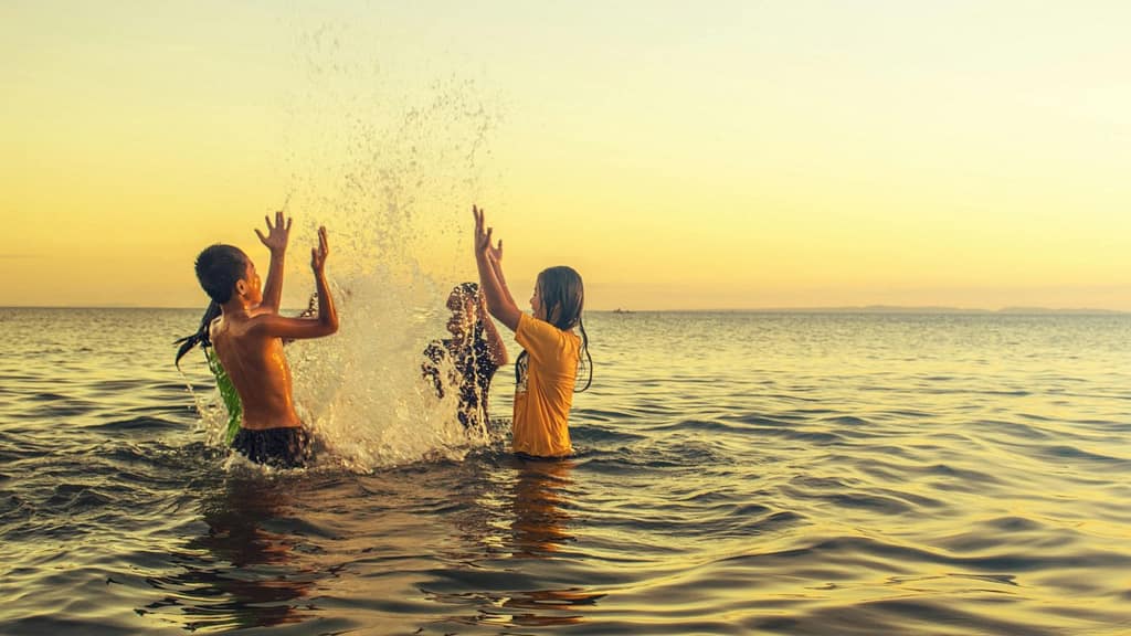 Family enjoying beach activities in Cancun Mexico – best things to do in Cancun with kids