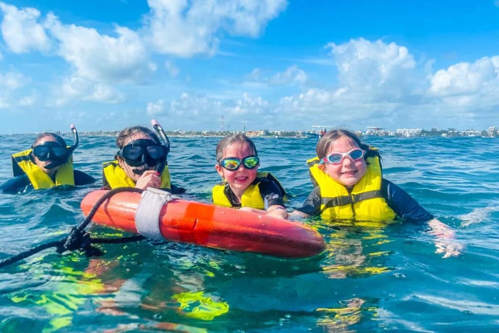 cancun-snorkeling-family-kids-1200x800 | Go With The Family Family snorkeling in clear shallow water in Cancun with kids