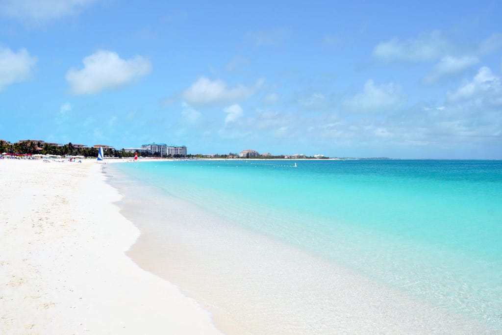 grace-bay-beach-turks-and-caicos | Go With The Family Grace Bay Beach in Turks and Caicos with calm turquoise water and soft white sand, perfect for families
