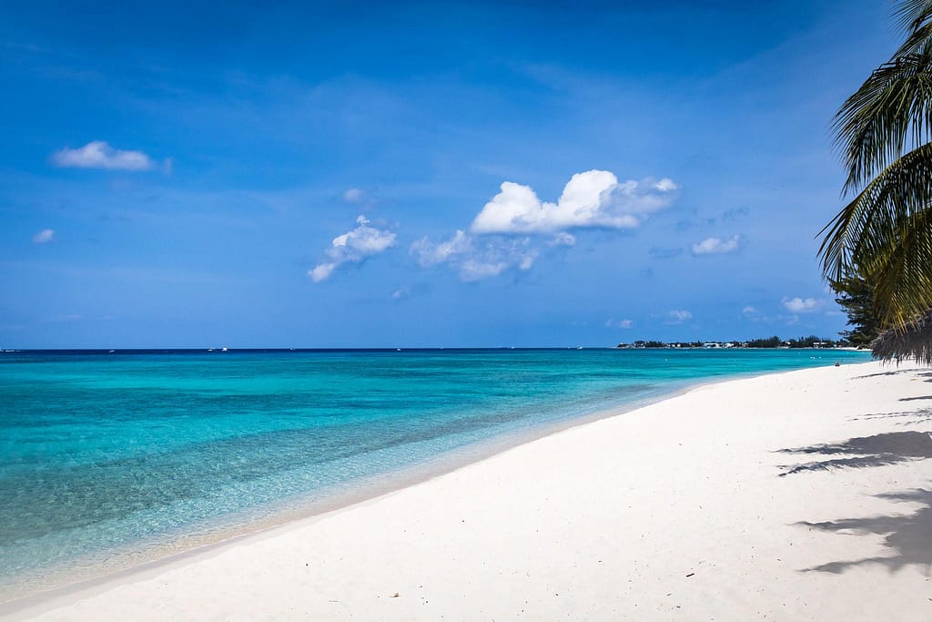 seven-mile-beach-grand-cayman | Go With The Family Seven Mile Beach in Grand Cayman with calm turquoise water and wide white sand shoreline, ideal for families