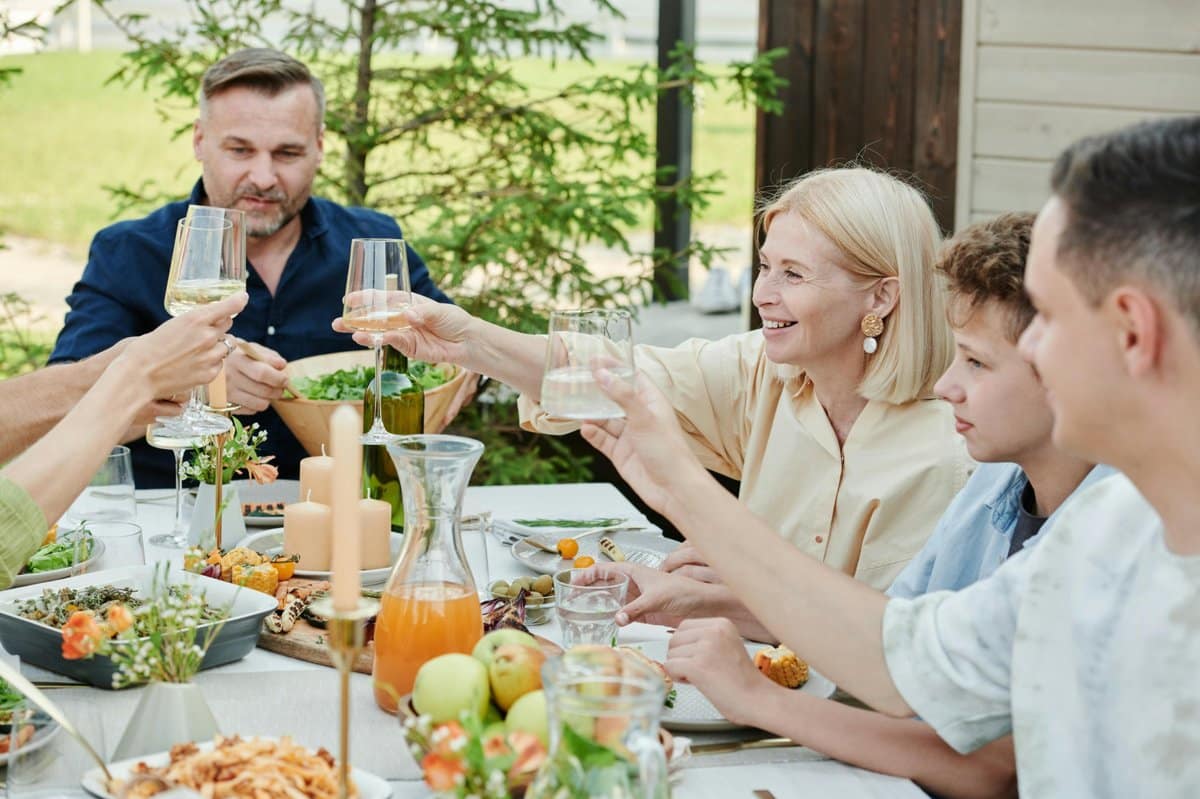 family_meal_1200 3 | Go With The Family Family enjoying a meal outdoors during a relaxed vacation day