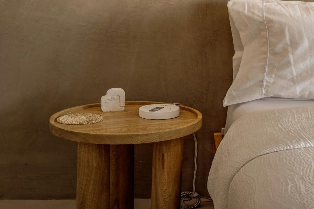 cozy-bedroom-sound-machine-1200x800 | Go With The Family Cozy Airbnb-style bedroom with nightstand, sound machine.