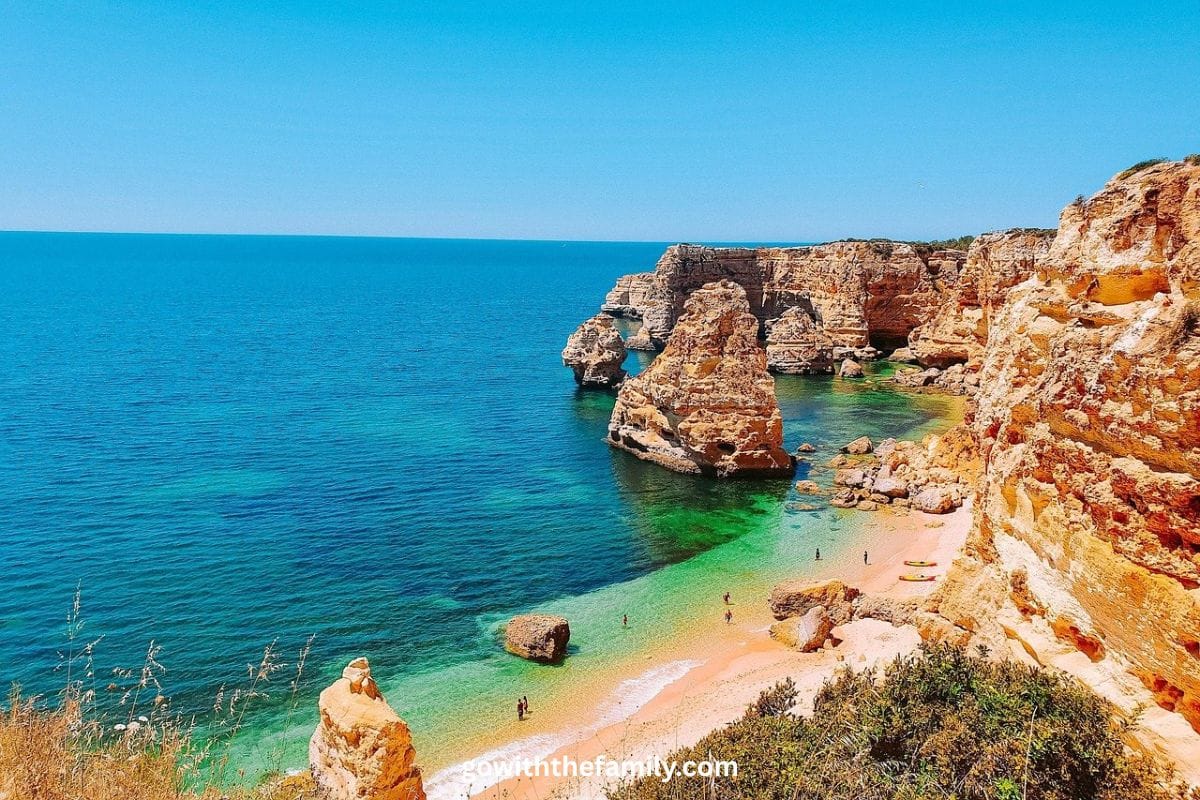 algarve-lagos-portugal-family-beach | Go With The Family Golden cliffs and turquoise water along the Algarve coast near Lagos Portugal