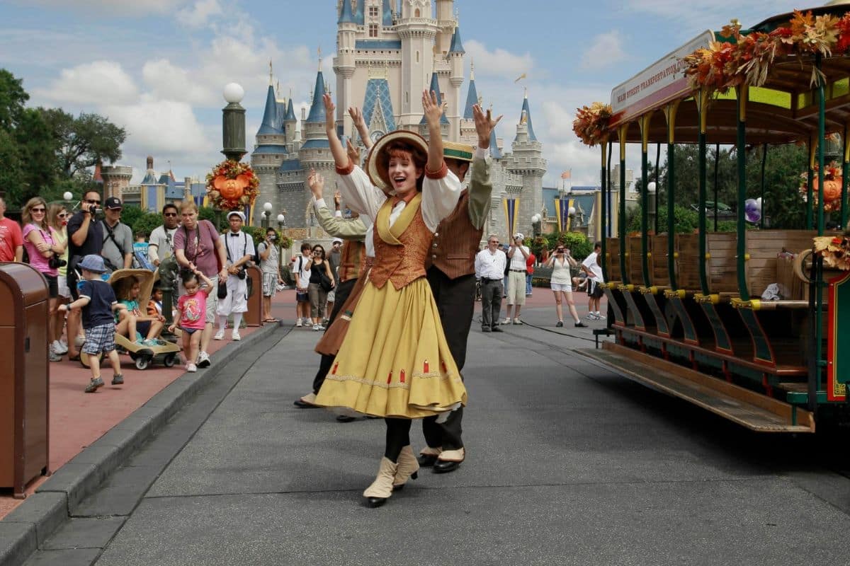 disney-world-main-street-parade-family-fun | Go With The Family Disney parade on Main Street USA at Magic Kingdom with families enjoying the entertainment.