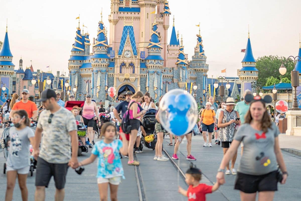 family-walking-from-cinderella-castle-disney-world-1200x800 | Go With The Family Family walking from Cinderella Castle at Disney World's Magic Kingdom during a family vacation.