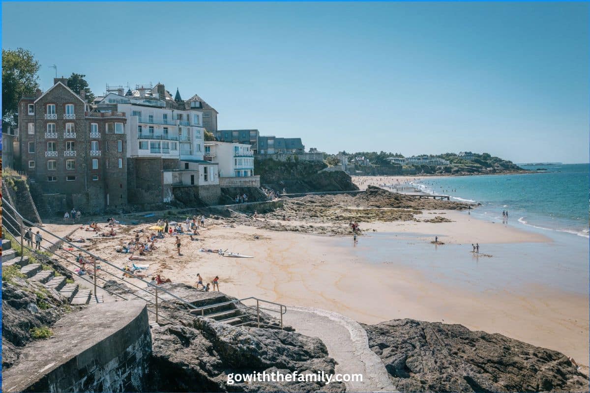 france-family-beach-destination-dinard-brittany | Go With The Family Sandy beach and coastal buildings in Dinard, Brittany, France