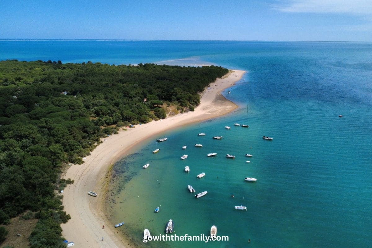 france-family-beach-destination-ile-de-re | Go With The Family Aerial view of Île de Ré with sandy beaches, calm water, and coastal scenery in France