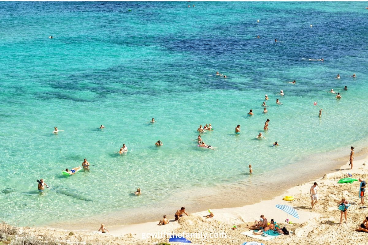 mallorca-family-beaches-balearic-islands-spain | Go With The Family Families enjoying the clear turquoise water at a beach in Mallorca, Spain