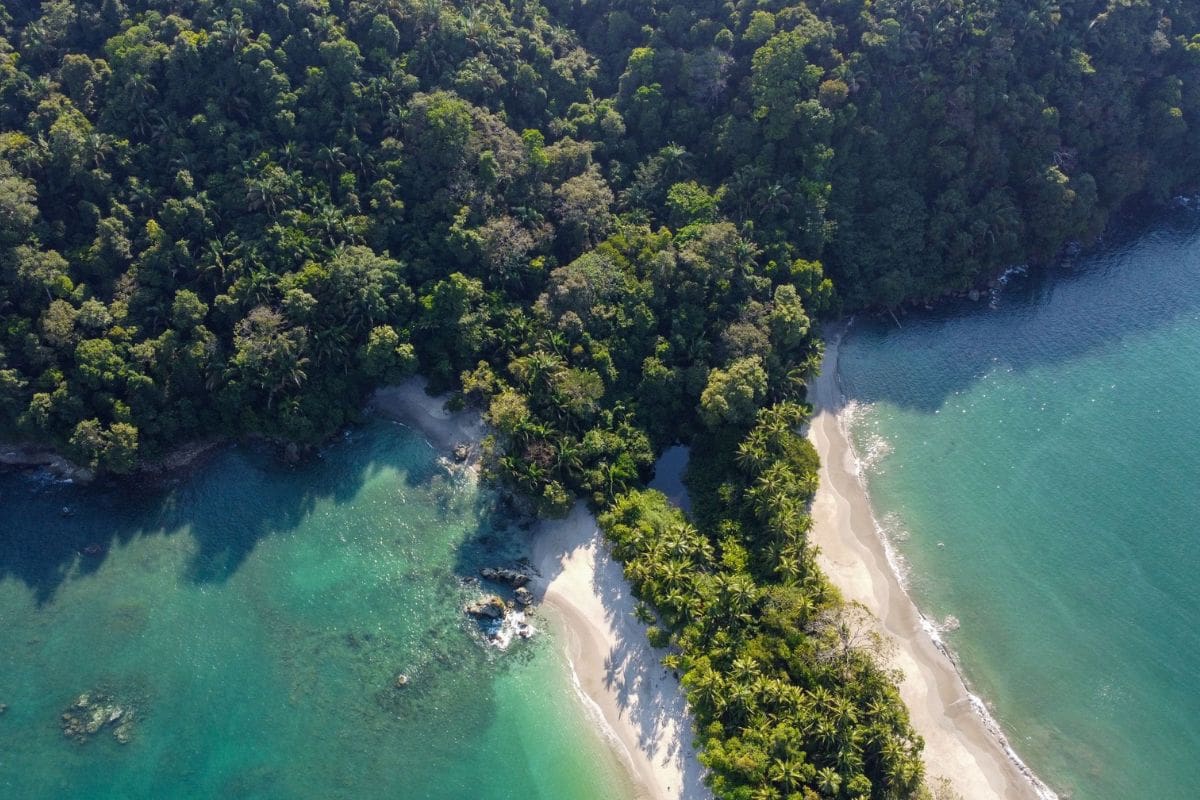 manuel-antonio-national-park-costa-rica-family.jpg | Go With The Family Aerial view of Manuel Antonio National Park in Costa Rica, where tropical rainforest meets white-sand beaches and turquoise Pacific waters.