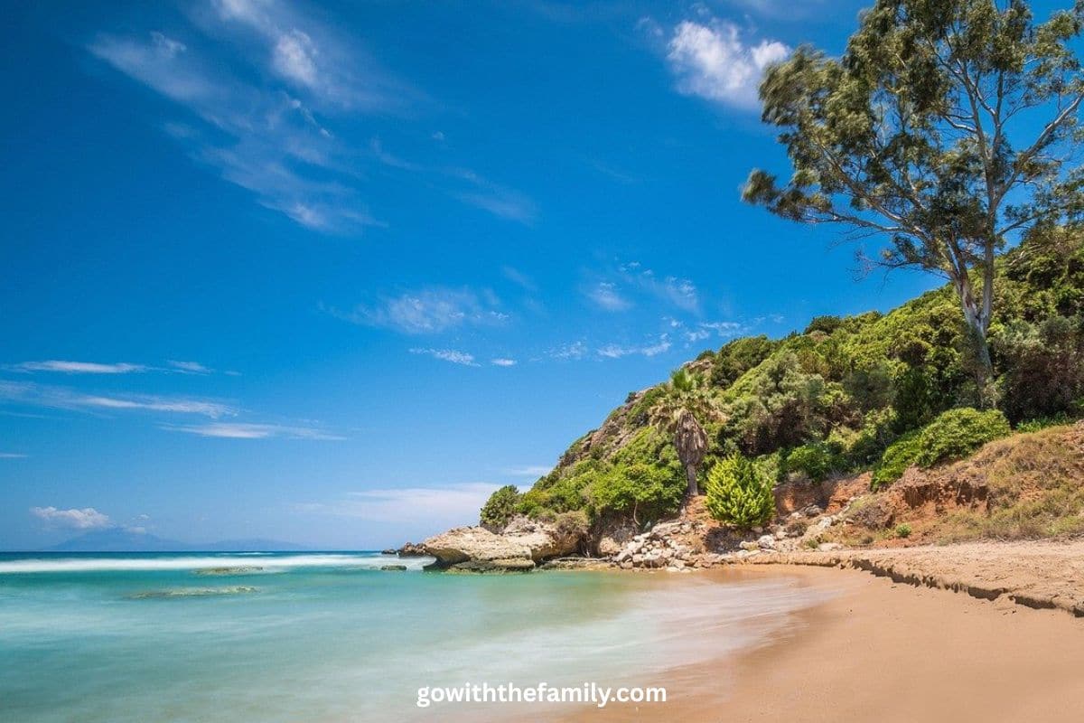 Peloponnese Family Beaches Greece | Go With The Family Sandy beach and turquoise coastline in the Peloponnese region of Greece.