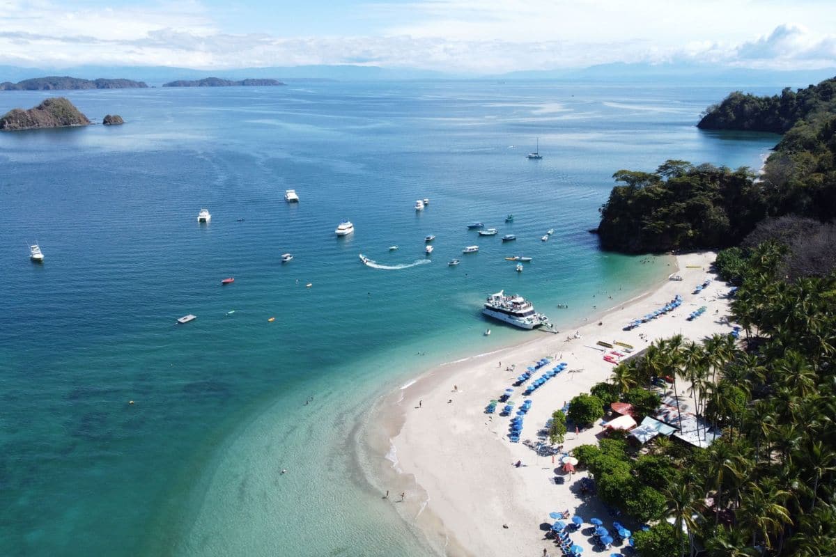 Playa Conchal, Guanacaste, Costa Rica | Go With The Family Aerial view of Playa Conchal in Guanacaste, Costa Rica, with turquoise water and a white shell beach ideal for family vacations.