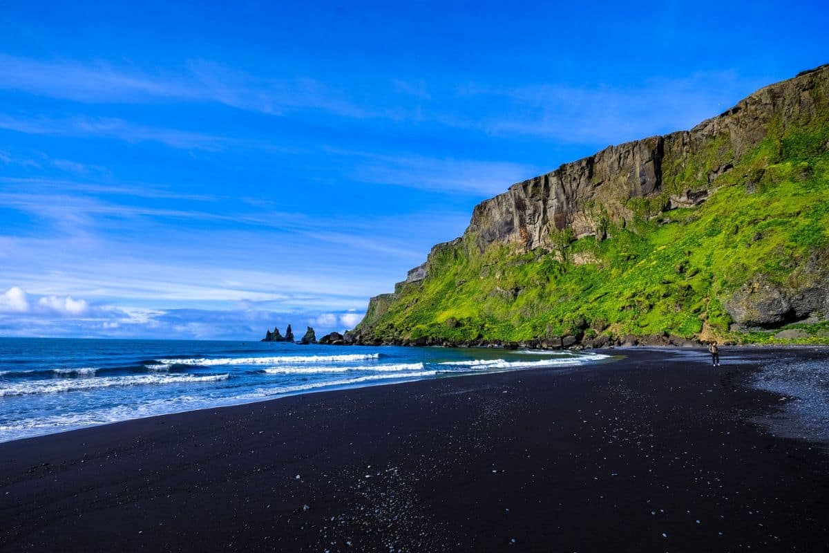 reynisfjara-black-sand-beach-iceland-ring-road-1200x800 | Go With The Family Reynisfjara Black Sand Beach along Iceland's Ring Road, with dramatic volcanic cliffs and Atlantic coastline.