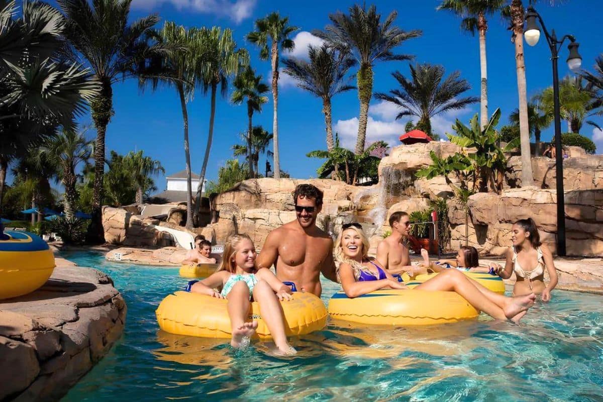 cancun-family-resort-pool-kids-1200x800 | Go With The Family Family enjoying resort pool in Cancun with kids and palm trees