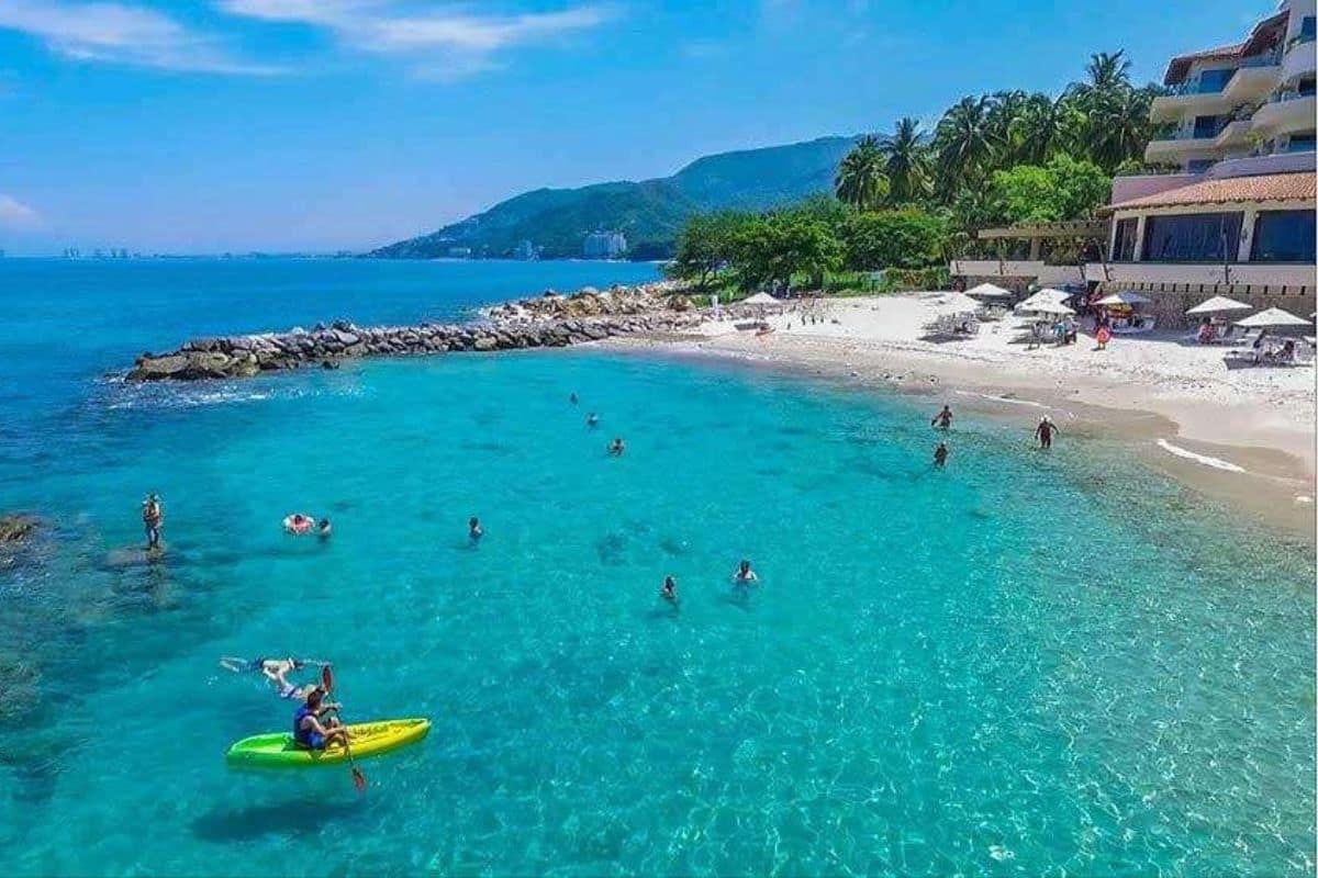 Families enjoying calm turquoise water in Puerto Vallartas Banderas Bay | Go With The Family Families enjoying calm turquoise water in Puerto Vallarta’s Banderas Bay