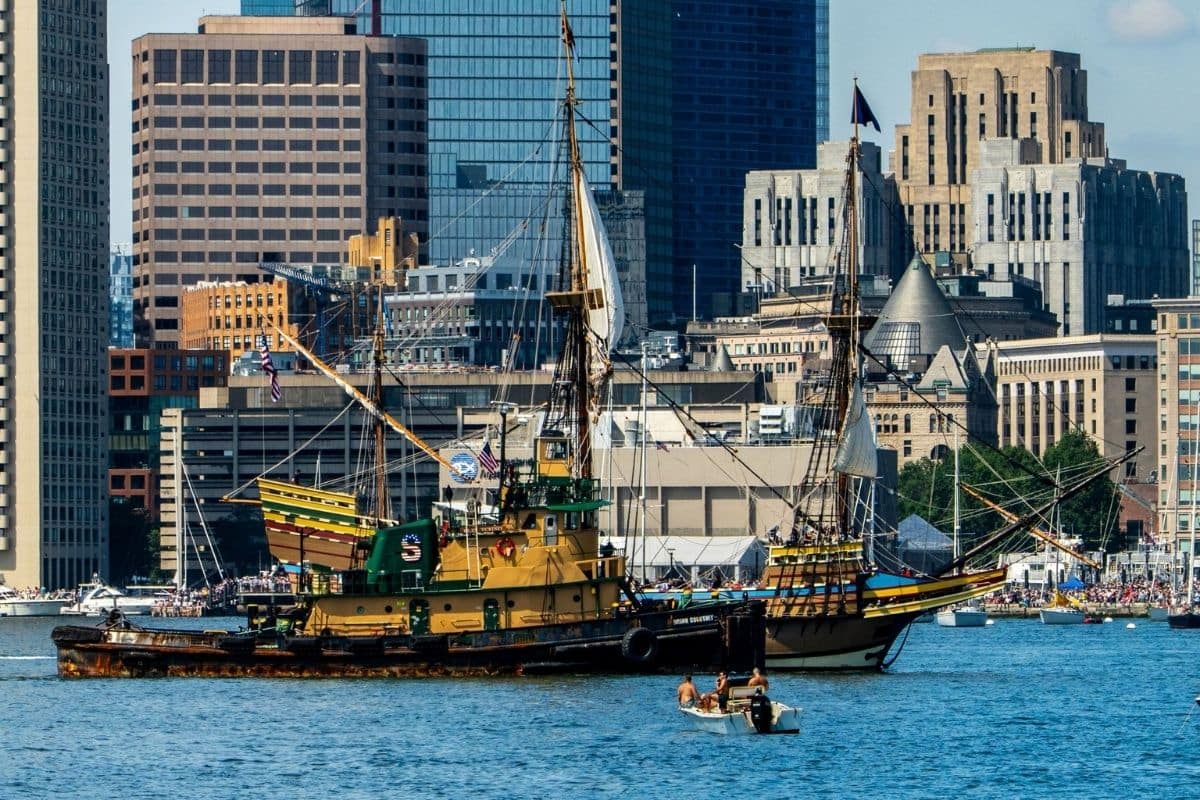 Boston Harbor — New England Road Trip | Go With The Family Historic sailing ships on Boston Harbor with the city skyline in Massachusetts