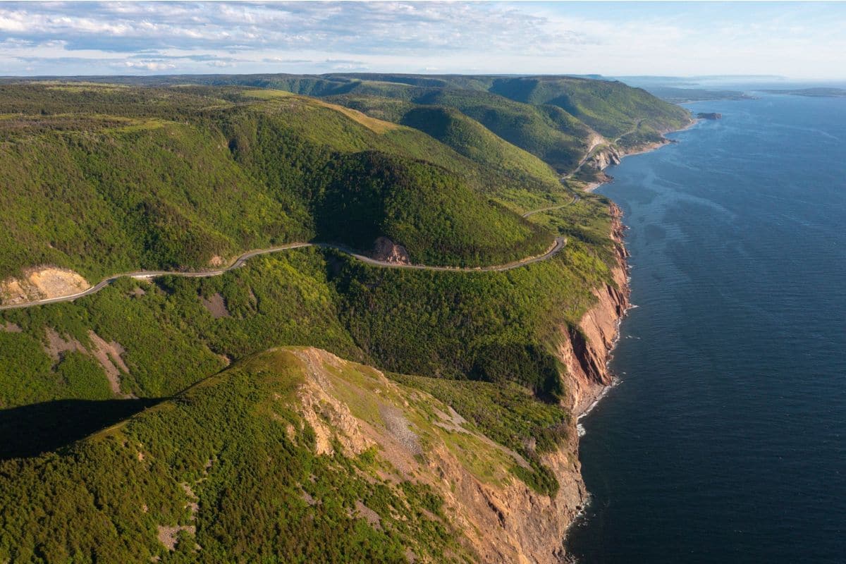 Cabot Trail in Cape Breton, Nova Scotia | Go With The Family Cabot Trail winding through the Cape Breton Highlands beside the ocean in Nova Scotia
