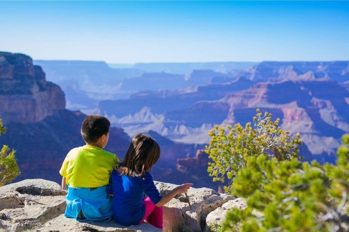 Grand Canyon South Rim — Family View | Go With The Family Children looking across the Grand Canyon from the South Rim in Arizona