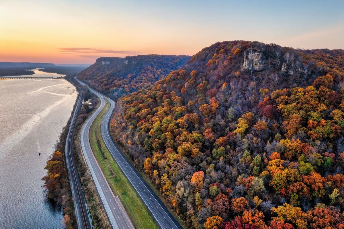 Great River Road Mississippi Family Road Trip | Go With The Family Great River Road beside the Mississippi River and autumn-covered bluffs on a family road trip