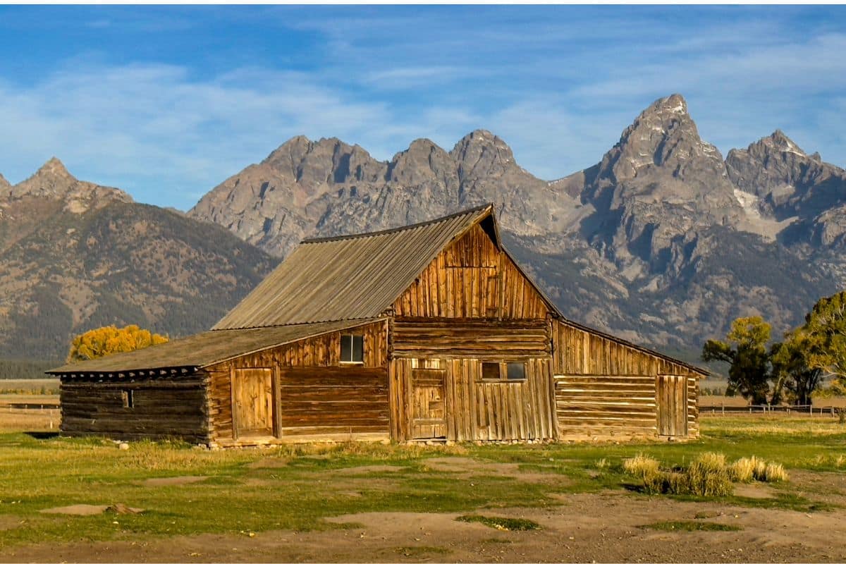 Historic Barn and the Teton Range, Grand Teton National Park | Go With The Family Historic wooden barn with the Teton Range rising behind it in Grand Teton National Park