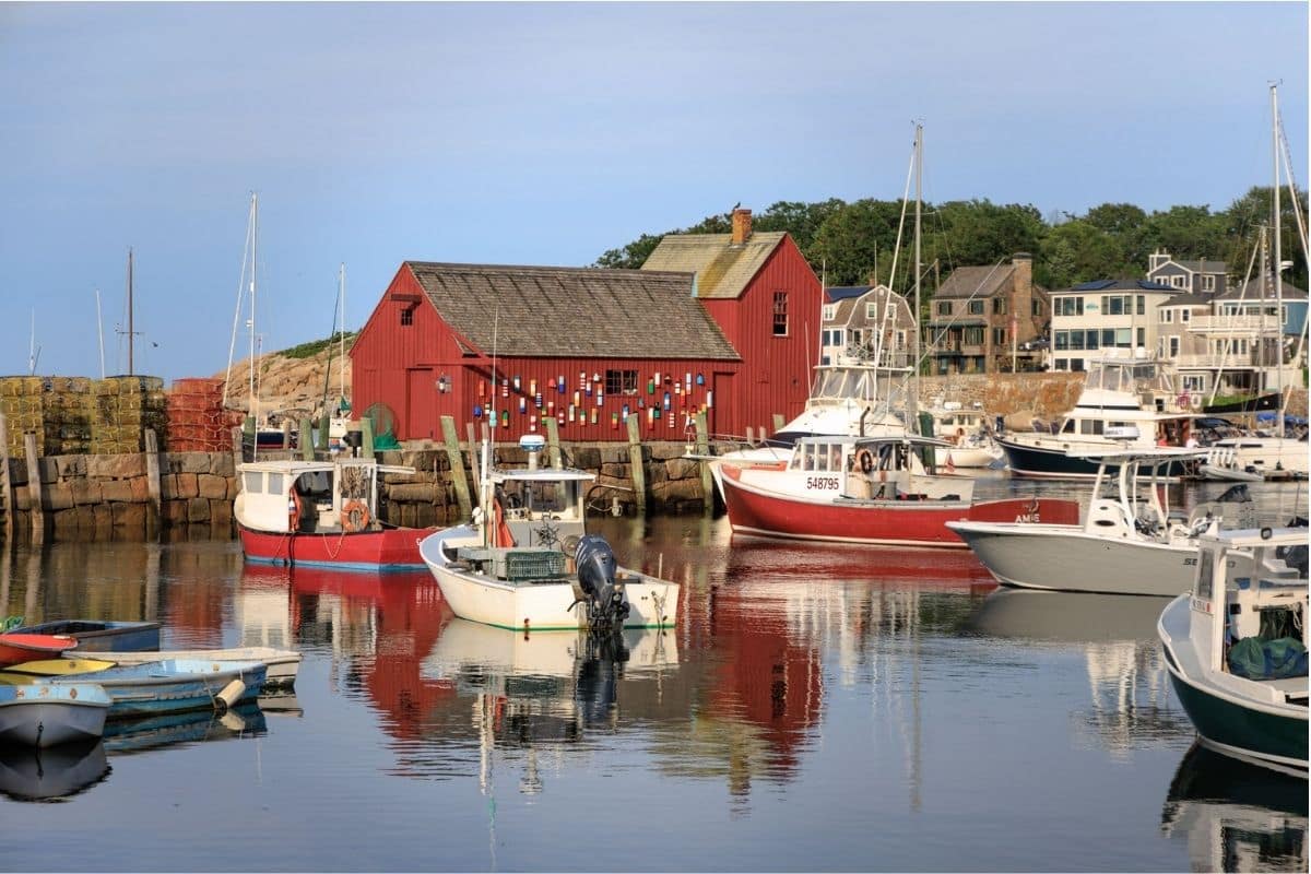 Rockport Harbor and Motif No. 1 | Go With The Family Rockport Harbor with fishing boats and the red Motif No. 1 building in Massachusetts