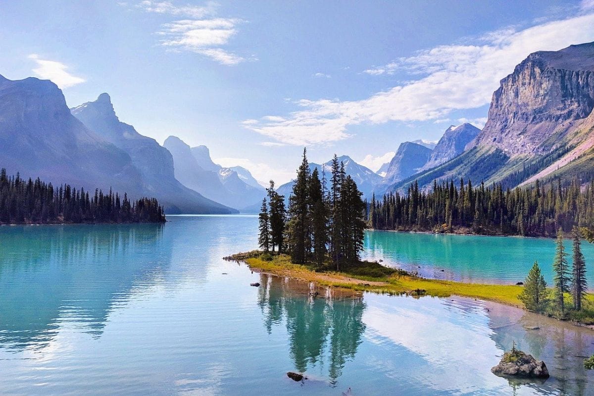 Spirit Island on Maligne Lake in Jasper National Park | Go With The Family Spirit Island on turquoise Maligne Lake surrounded by mountains in Jasper National Park, Alberta