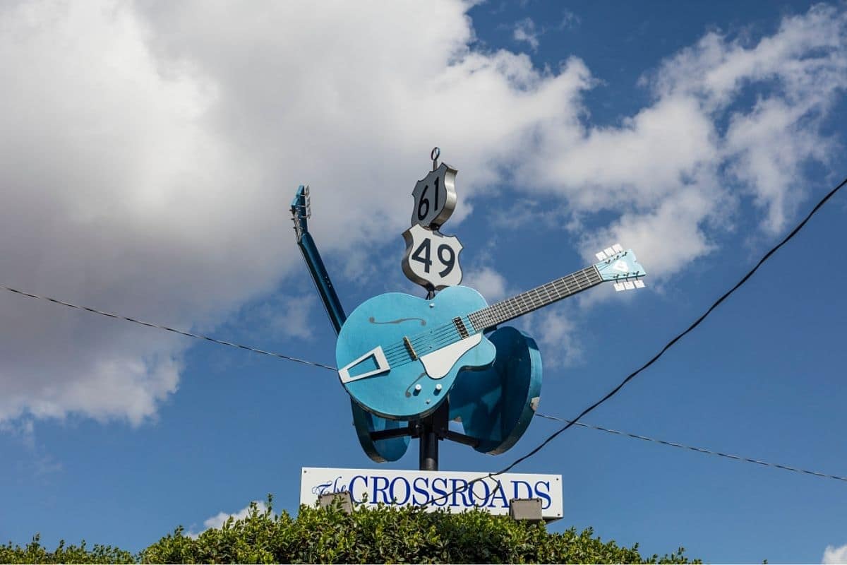 Clarksdale Crossroads — Highways 61 and 49 | Go With The Family Crossroads guitar sign marking Highways 61 and 49 in Clarksdale, Mississippi