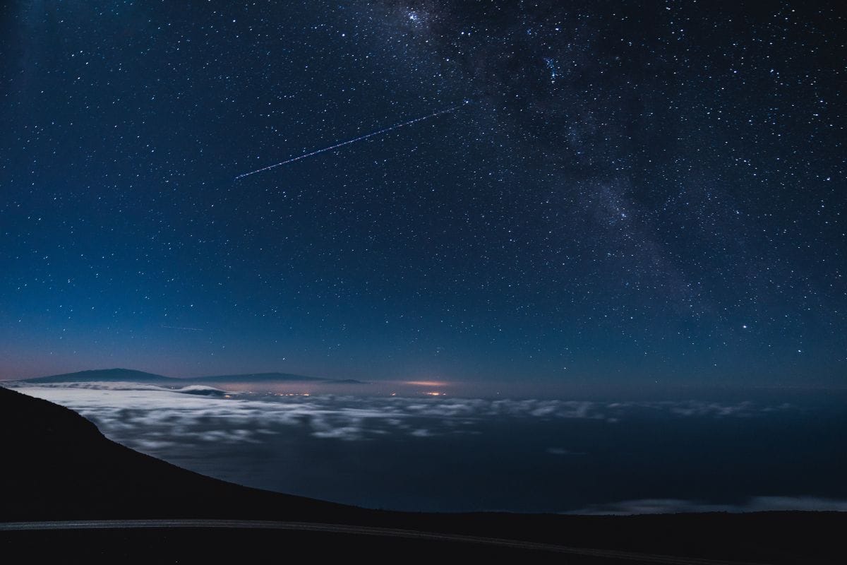 Starry Sky Above Haleakalā Summit | Go With The Family Star-filled night sky above the clouds from Haleakalā Summit on Maui, Hawaii