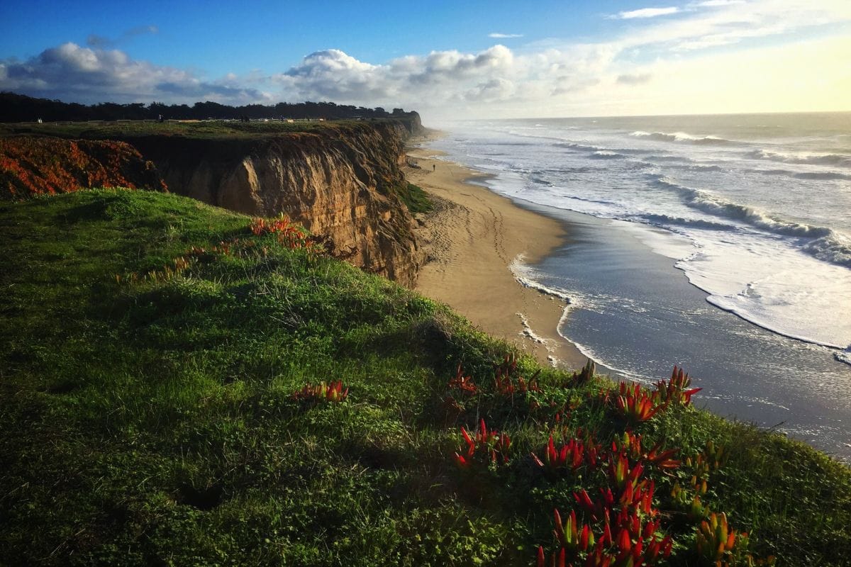 Half Moon Bay Coastal Cliffs | Go With The Family Coastal cliffs and sandy beach overlooking the Pacific Ocean at Half Moon Bay, California