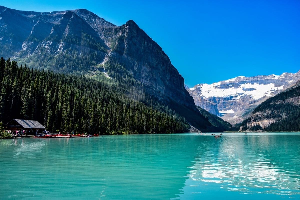 Lake Louise and Victoria Glacier | Go With The Family Turquoise water of Lake Louise beneath snow-covered mountains and Victoria Glacier in Banff National Park, Alberta