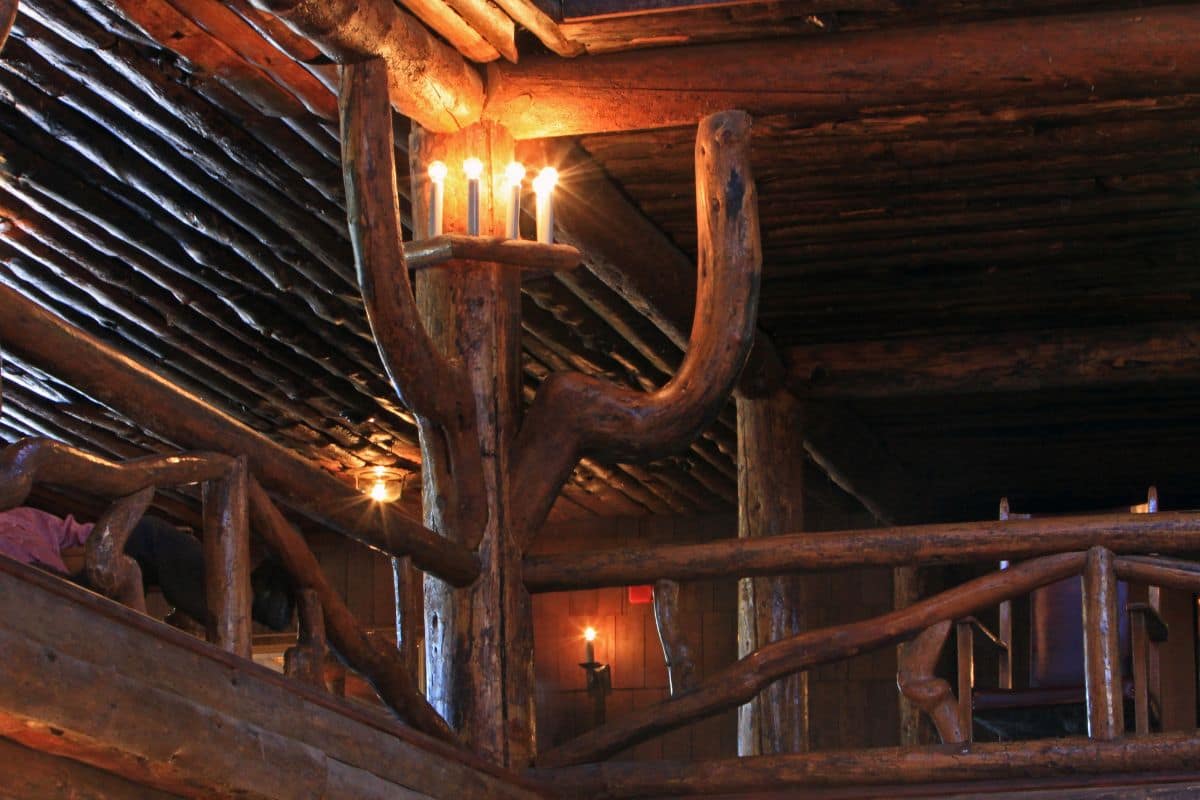 Old Faithful Inn Lobby Architecture | Go With The Family Rustic log supports, railings and timber architecture inside the Old Faithful Inn lobby in Yellowstone National Park